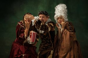 Medieval young man and women in old-fashioned costume